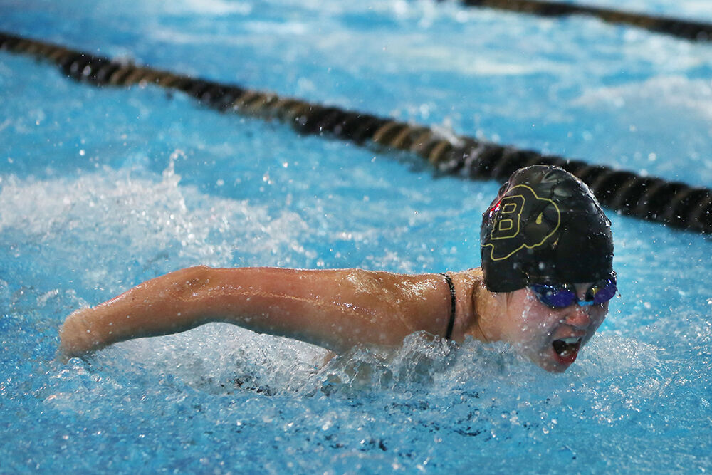 Vivyan Gripp takes a breath during the butterfly leg